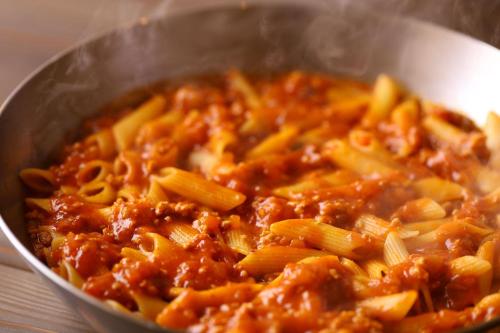 a bowl of pasta with sauce and pasta at KAMENOI HOTEL Kujukuri in Asahi