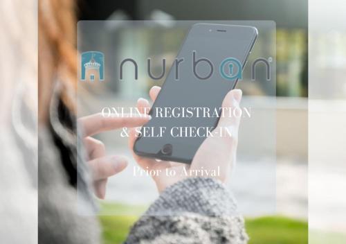 a person taking a picture of a cell phone at Nurban Apartments Oldtown in Nürnberg