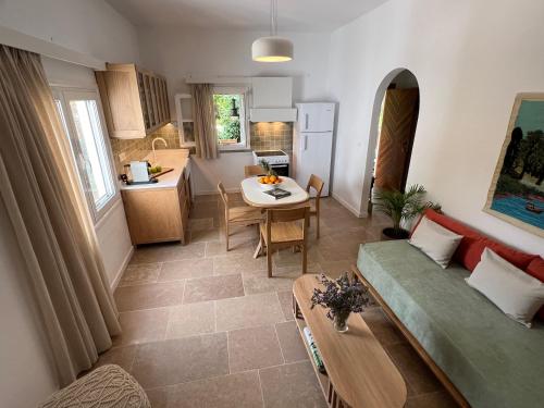 a living room with a couch and a table at Sycamore House in Skiathos Town