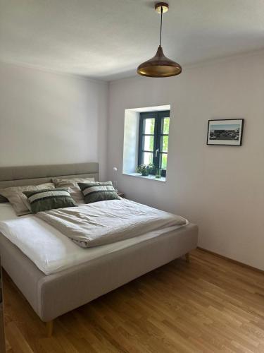 a bedroom with a large bed in a room at Buchmühle in Niederdorla