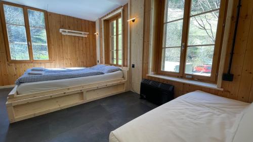 Postel nebo postele na pokoji v ubytování Alpenhof Mountain Lodge