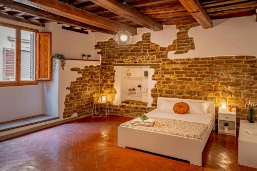 En eller flere senge i et værelse på Dante's Room dei Cerchi
