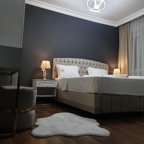 Postel nebo postele na pokoji v ubytování Golden Homes