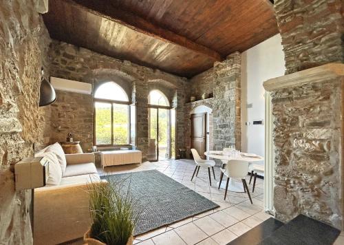 a living room with a couch and a table at Pietra Azzurra, Newly Renovated in Corniglia