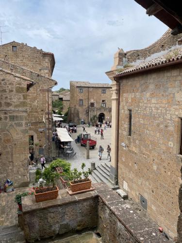 a view of a street from an old building at Civita Home Belvedere in Civita di Bagnoregio