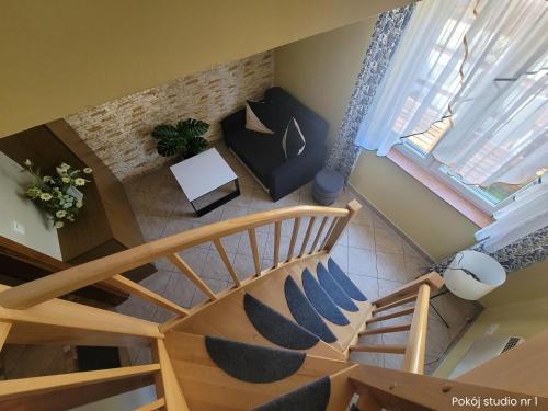 an overhead view of a staircase in a house at Apartamenty Liliowy Zakątek in Dębki