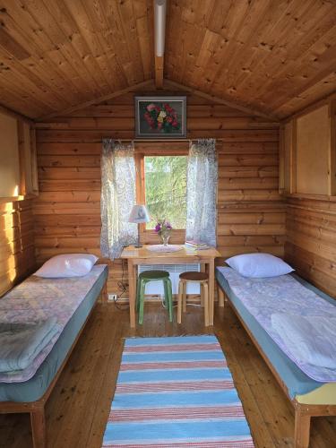 Letto o letti in una camera di Hännilänsalmi Camping
