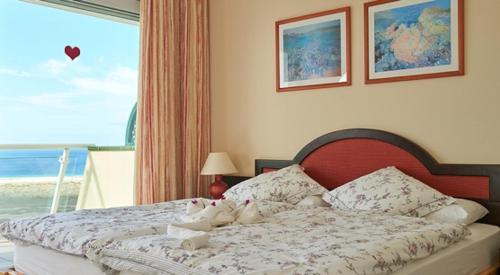 a bedroom with a bed with a view of the ocean at Balcon de Jandia Ático Penthouse in Morro del Jable