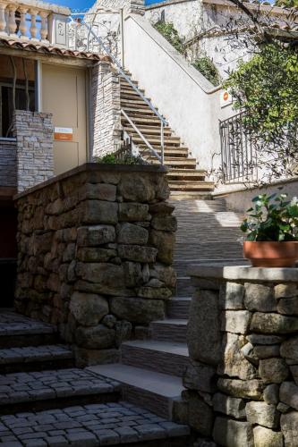 a set of stone stairs in front of a house at In Provence Hôtel - Expérience Authentique in Venelles