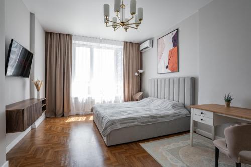 Ένα ή περισσότερα κρεβάτια σε δωμάτιο στο EXPO UNION Apartments