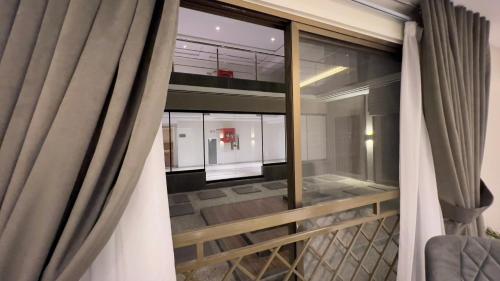 a view of a balcony from a room with a window at 1 BHK Sleek Suite Apt in Bahria Heights 1 in Rawalpindi