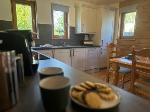 a kitchen with a plate of food on a table at The New Farmhouse in Biggar