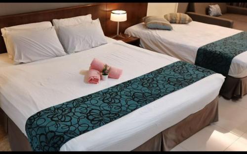 Postel nebo postele na pokoji v ubytování YUYU A12 Honeymoon GVR GENTING HIGHLAND
