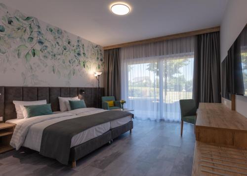 Postel nebo postele na pokoji v ubytování Szépia Bio and Art Hotel