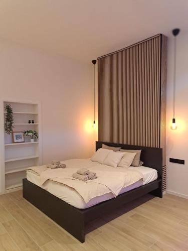 Postel nebo postele na pokoji v ubytování Boomgaard de Luxe