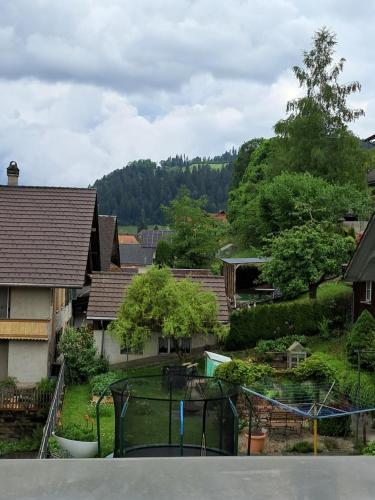 a view of a neighborhood with houses and trees at BERNA,Signau XXL in Signau