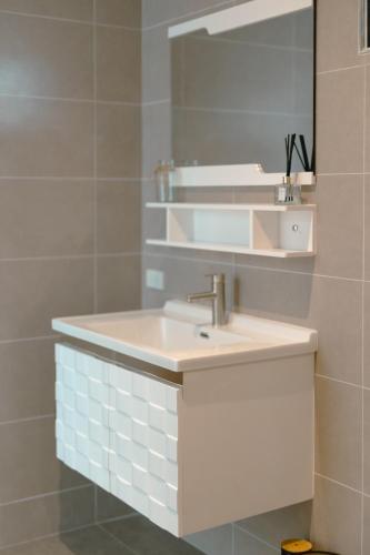 a bathroom with a sink and a mirror at Samui Paradise Poolside Villa in Nathon Bay