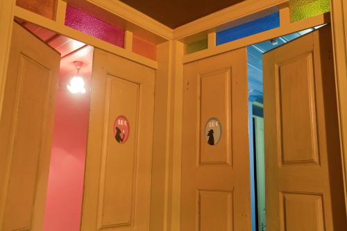 a room with brightly colored walls and doors at Mercearia da Vila in Ponte de Lima