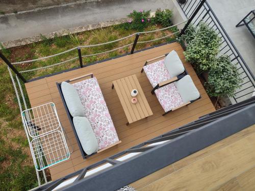 an overhead view of a balcony with a table and pillows at ELEVEN in Šibenik