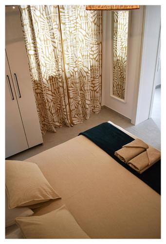a room with a large bed and a window at ELEVEN in Šibenik