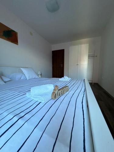 Postel nebo postele na pokoji v ubytování Apartmani "Bodulo"