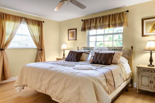 a bedroom with a large bed and a window at Family-Ready 4BR with Heated Pool & BBQ in North Fort Myers