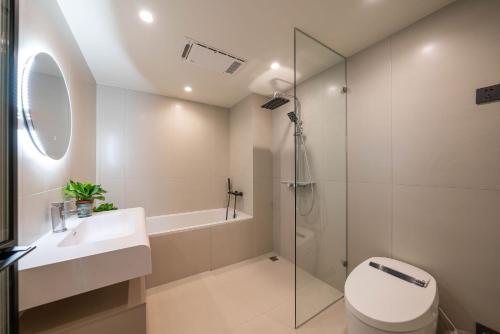 a bathroom with a toilet and a sink and a shower at Tonight Homestay West Nanjing Road Branch Shanghai in Shanghai