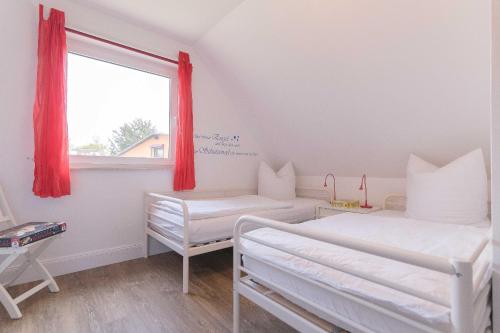 Ένα ή περισσότερα κρεβάτια σε δωμάτιο στο Ferienhaus ANNA
