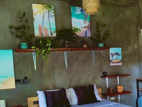 a living room with a couch and some pictures on the wall at SUMMER STAY A Starlink in General Luna