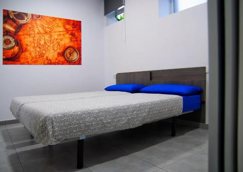 Кровать или кровати в номере Albergue Oceanus Finisterre