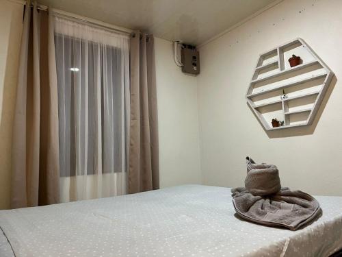 Ένα ή περισσότερα κρεβάτια σε δωμάτιο στο Casa de Campo Nara