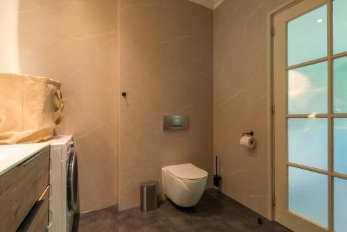 Koupelna v ubytování Cozy House - fietsverhuur, eigen keuken en badkamer