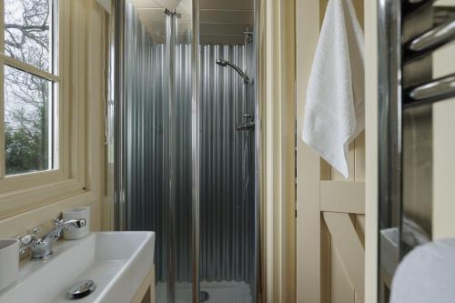 a bathroom with a shower and a sink at The Cotswold Nest in Moreton in Marsh