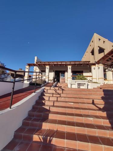 a set of stairs in front of a building at Altos de Amaicha Posada Boutique in Amaicha del Valle