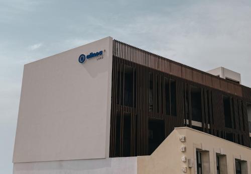 a building with a sign on the side of it at Alinea Lano Old Town Center in Limassol