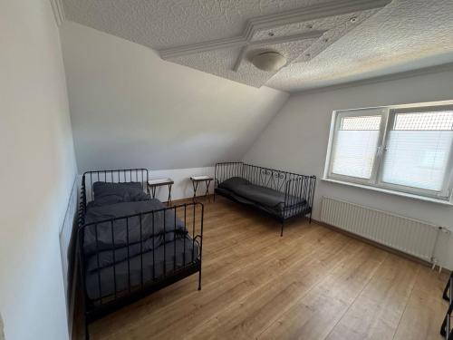a bedroom with two bunk beds and a window at LlVINQ 11 in Emstek