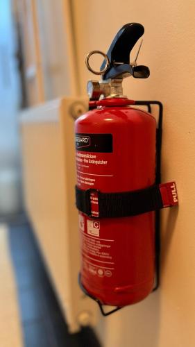 a fire hydrant is attached to a wall at Villa South Beach in Karlskrona