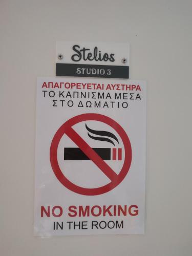 a sign that says no smoking in the room at Stelios studio 3 in Vouvás