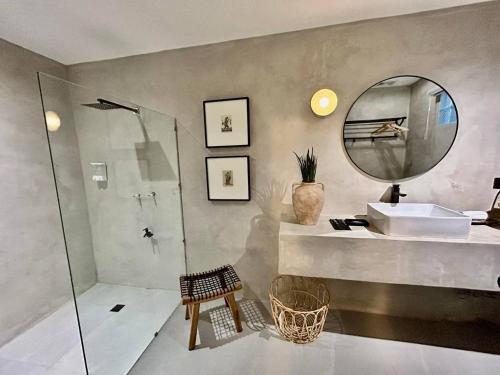 a bathroom with a sink and a mirror at Casa Katipunan in Manila