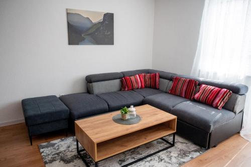 a living room with a couch and a coffee table at Stan na dan Gornji Vakuf Uskoplje in Gornji Vakuf