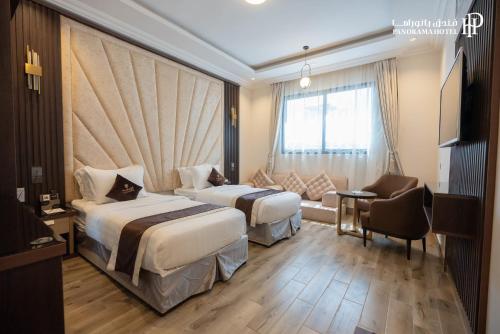 Postel nebo postele na pokoji v ubytování فندق بانوراما Panorama Hotel