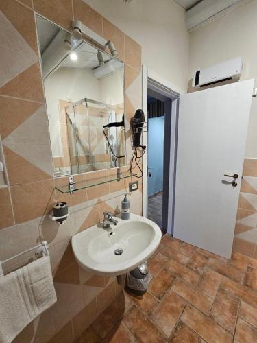 a bathroom with a sink and a mirror at Country house "L'isola che non c'è" in Ancona