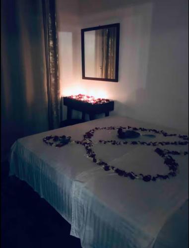 a room with a bed with a heart on it at Well equipped apartment with luxurious interior furnishings in Tangier