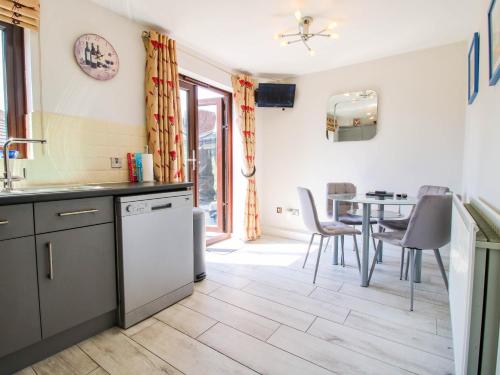 a kitchen and dining room with a table and chairs at 63 Severn Street in Bridgnorth