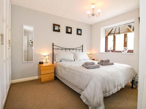 a bedroom with a large bed and a window at 63 Severn Street in Bridgnorth
