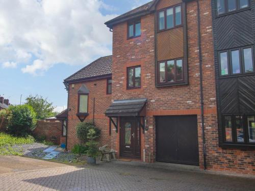 a brick house with a garage in front of it at 63 Severn Street in Bridgnorth