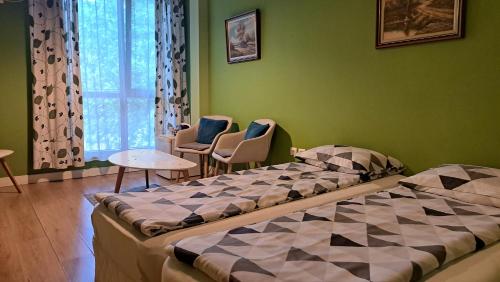 A bed or beds in a room at Sasso-студио 3