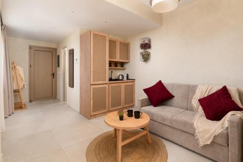 a living room with a couch and a table at Açai Plant Based Hotel in Rhodes Town