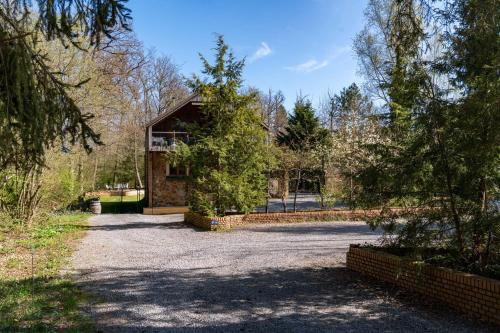 a house in the middle of a driveway at Gite Moments à Soy in Soy