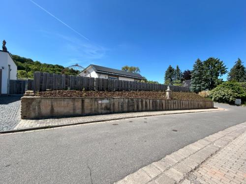 a fence on the side of a road at Feriendomizil im Saarschleifenland in Mettlach
